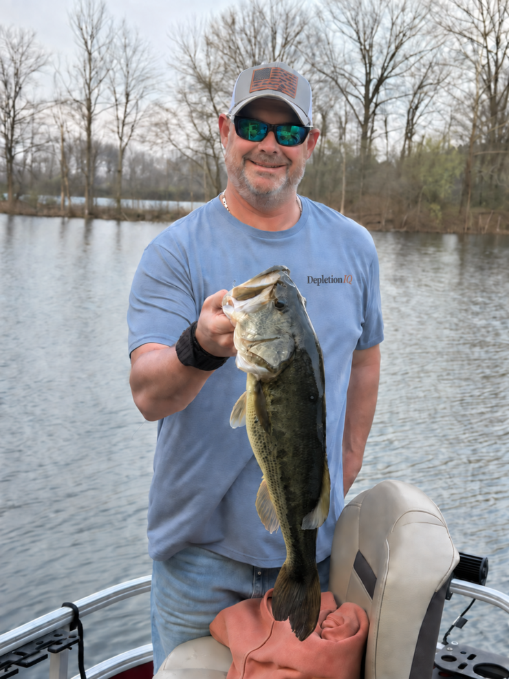 John Slimak fishing, wearing a DepletionIQ shirt